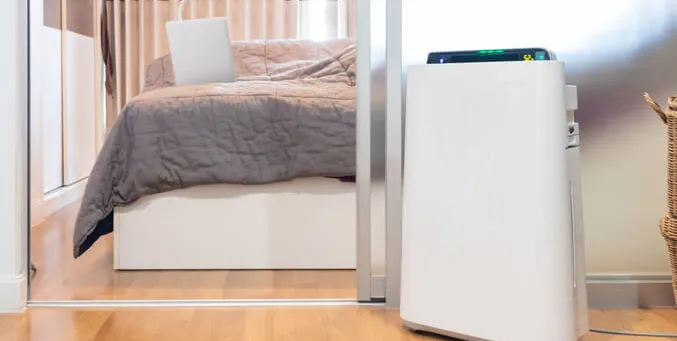 Where should an air purifier be placed in a bedroom
