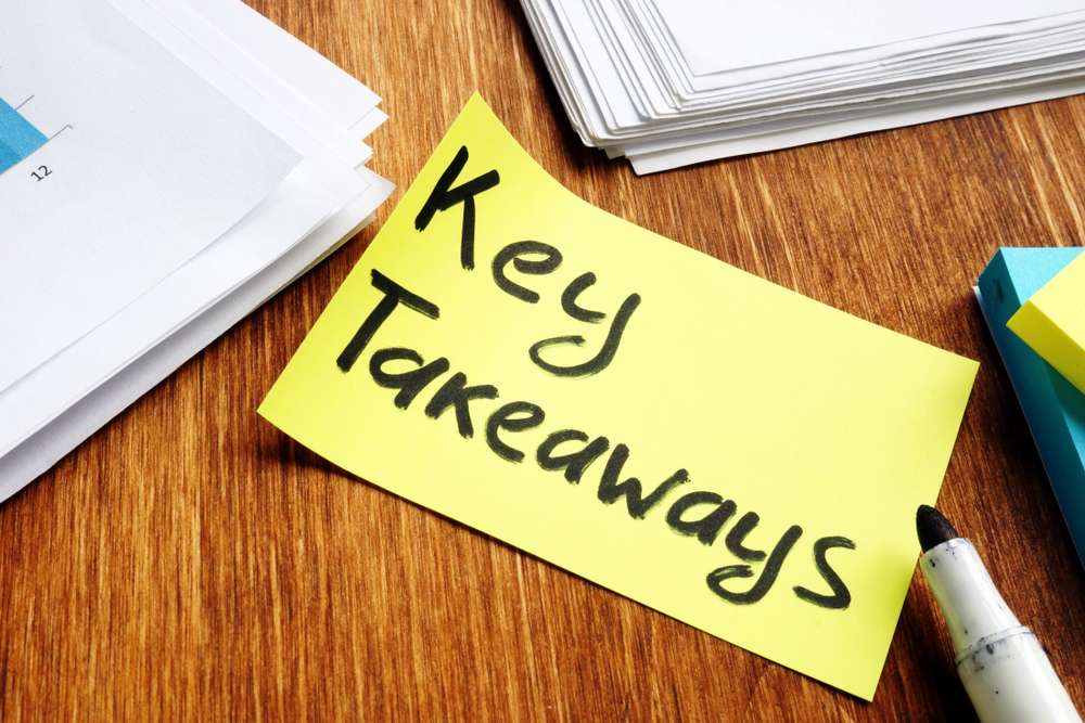 Yellow post-it note with the words, "Key Takeaways" written on it in marker.